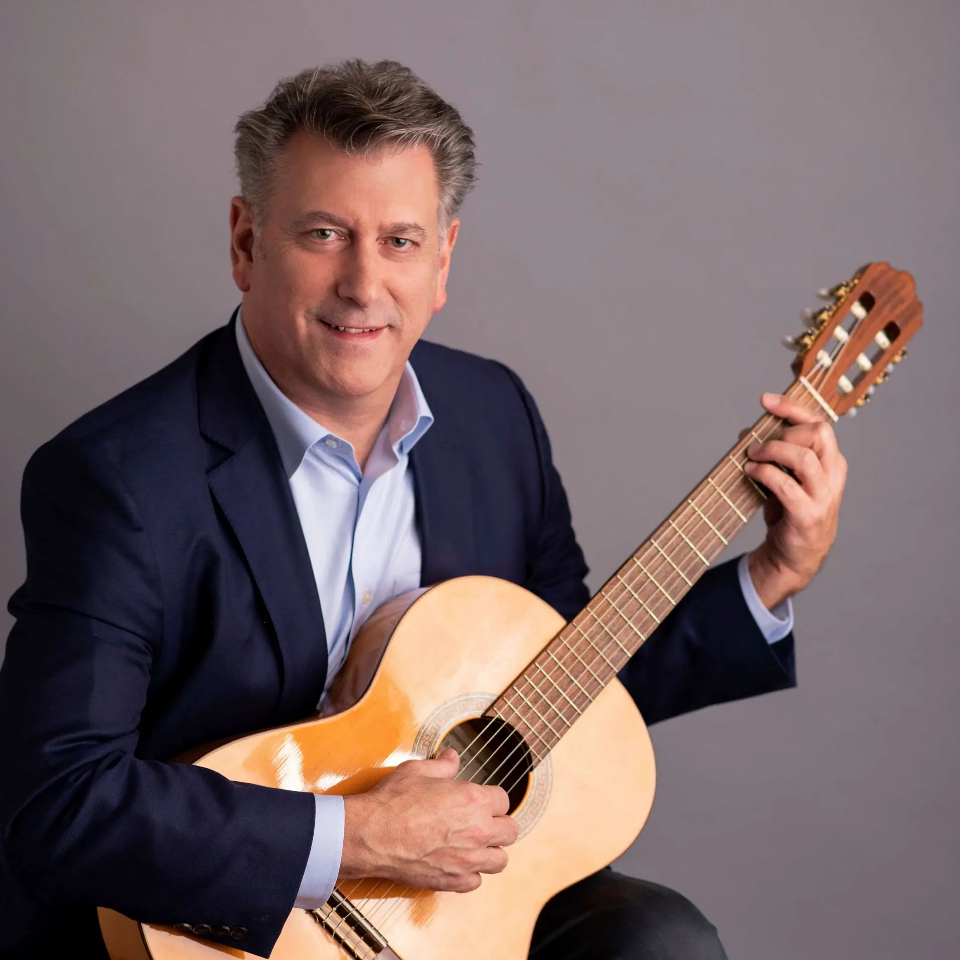 john-rafferty-holding-guitar-square
